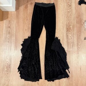 Black velvet flare pants with ruffles and lace details. Size: XS-S